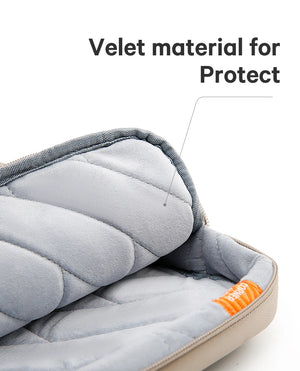 Laptop bag interior with soft gray lining, quilted padding, and orange accent tag