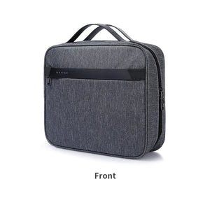 Gray collapsible waterproof toiletries bag with front zipper and top carry handle