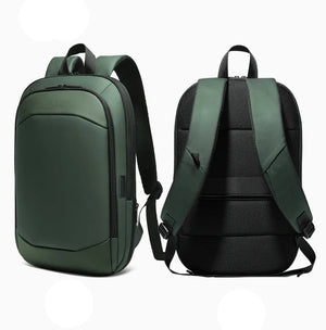 Green expandable travel backpack with front pocket and padded back straps