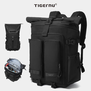 Black waterproof travel backpack with front zip pockets and padded shoulder straps.