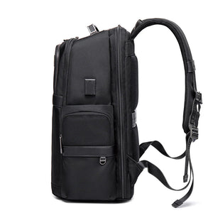 Black waterproof backpack with side pocket, front organizer panel, and adjustable shoulder straps