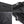 Black backpack fabric with water-drop texture and metal zipper pull detail