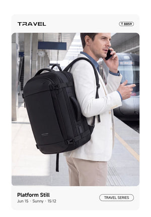 Black waterproof business backpack worn on person, front panel and shoulder straps visible.