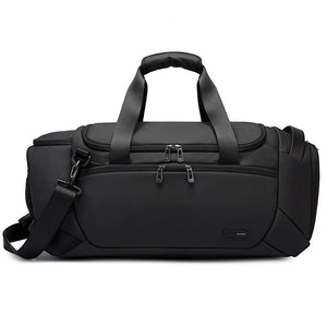 Black waterproof duffle bag front view with side straps and top carry handle