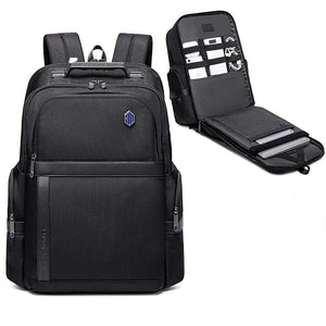 Black waterproof travel backpack with front panel and fold-out organizer featuring document slots