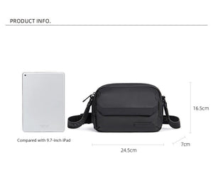 Black compact crossbody bag with flap front, zip pocket, and adjustable strap