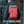 Red waterproof travel backpack with front zipper pocket and adjustable shoulder straps