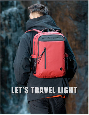 Red waterproof travel backpack with front zipper pocket and adjustable shoulder straps