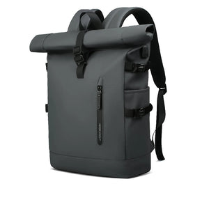 Black roll-top waterproof travel backpack with front pocket, buckles, and shoulder straps