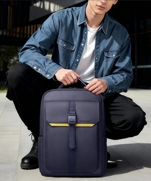 Navy waterproof backpack with front magnetic buckle pocket and yellow accent strip