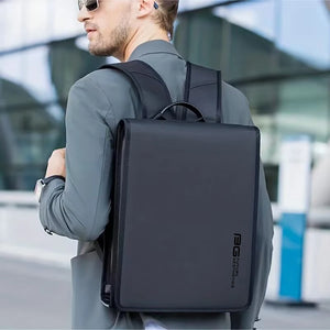 Black compact backpack worn by a man in a city setting