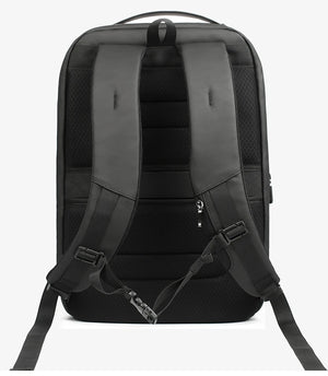 Black travel backpack back view with padded shoulder straps and adjustable chest strap
