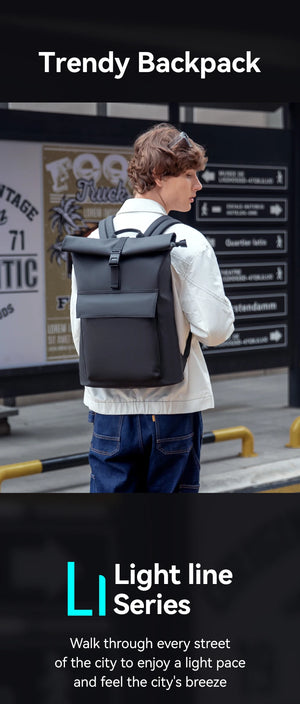 Grey roll-top waterproof backpack on person standing outdoors with shoulder straps