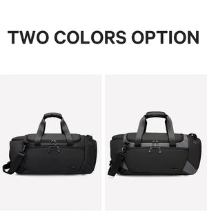 Large waterproof duffle bag in black with top handle and detachable shoulder strap