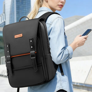 Black commuter backpack with front flap, orange accent stripe, and adjustable shoulder straps