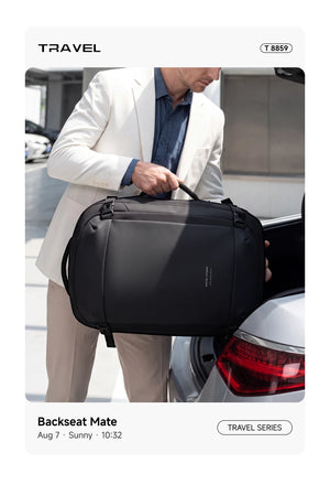 Black waterproof business backpack being placed on a car trunk, side straps and front bag visible.