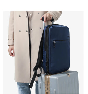 Blue compact waterproof backpack with front zipper and adjustable shoulder strap