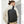 Black waterproof backpack worn on back with padded back panel and adjustable shoulder straps