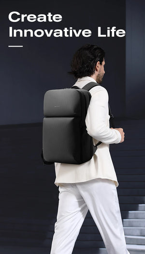 Black large travel backpack worn by a person, side view