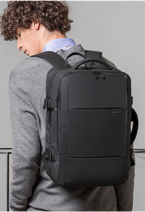 Back view of black large backpack with padded shoulder straps and back panel