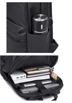 Black backpack with compartments for electronic devices and a mug.