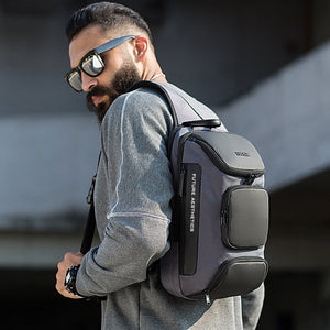 Black crossbody sling bag worn on the chest with front organizer pocket and adjustable strap