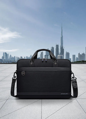 Black waterproof laptop bag front view with top handle and side zip pockets