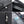 Black waterproof toiletry bag with metal zipper pull and internal mesh pockets