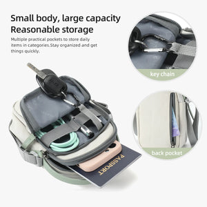 Compact crossbody bag open with inner pockets and key chain clip