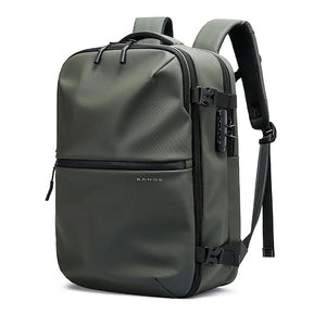 Dark green waterproof travel backpack with top handle, front strap buckles, and adjustable shoulder strap