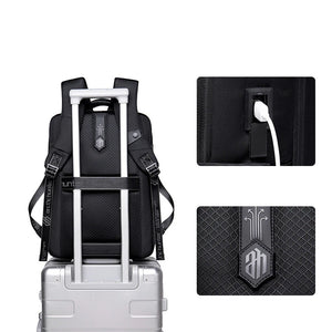Black travel backpack with trolley sleeve handle slot and front security pocket