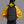Person wearing a black backpack with 'arctic hunter' branding on a gray background