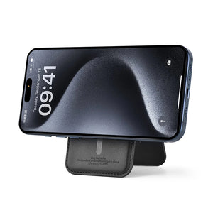 Black leather MagSafe card holder wallet attached to phone back with kickstand