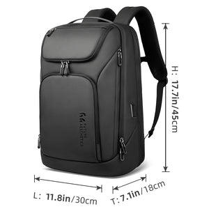 Large dark backpack with front zip pockets, top flap pocket, and padded shoulder straps