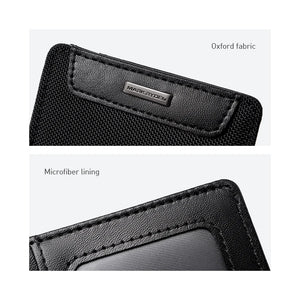 Black wallet exterior close-up with embossed logo plaque and stitched edge.