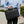 Black waterproof laptop bag with top handle and crossbody shoulder strap