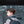 Black backpack worn on back with front flap pocket and laptop compartment