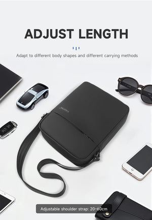 Black compact crossbody bag with long adjustable strap, shown laid flat.