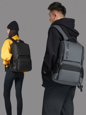 Black and gray travel backpack with front zip pocket, padded straps, and back view