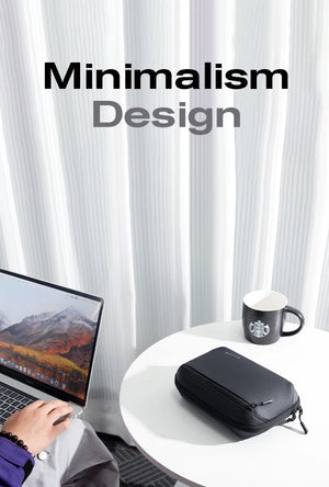Black minimalist waterproof tech storage bag with zipper, shown on tabletop