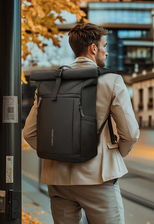 Black expandable roll-top backpack worn on back with adjustable shoulder straps