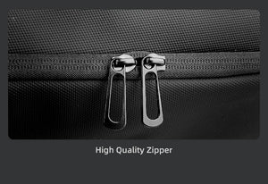 Black zipper with metal pull tabs on travel backpack