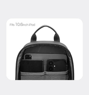 Top opening of dark gray sling bag with tablet sleeve and phone compartment pockets.