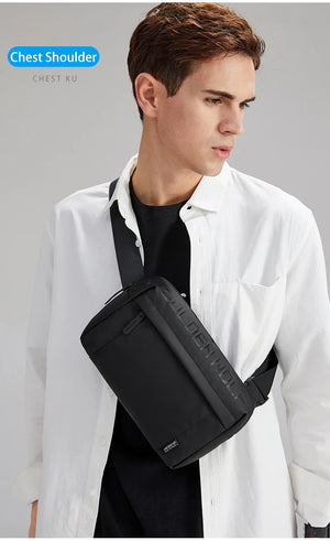 Black crossbody bag worn on chest with adjustable strap and zippered front compartment
