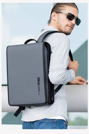 Black compact backpack worn on the side with front pocket visible