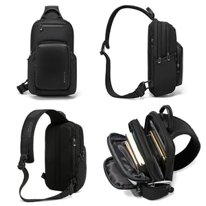 Black compact crossbody bag with front pocket, zip closures, and adjustable strap