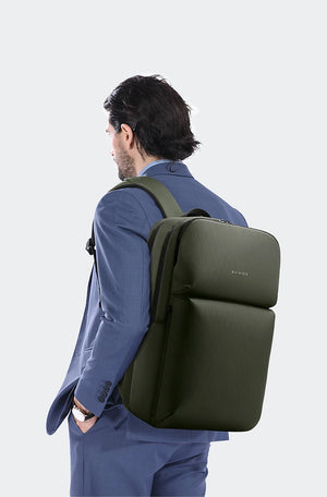 Olive green water-resistant travel backpack on person, back and side view