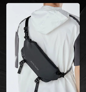 Black waterproof crossbody sling bag worn, side view with zip and strap