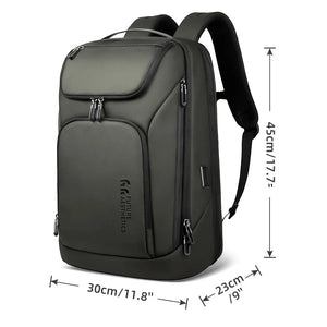 Large dark backpack with front zip pockets, top flap pocket, and padded shoulder straps