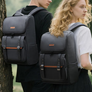 Black commuter backpack with flap front, top handle, and buckle trim